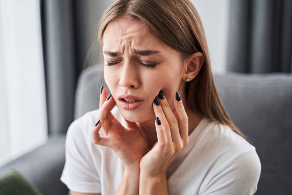 Dentist checking patient with facial swelling